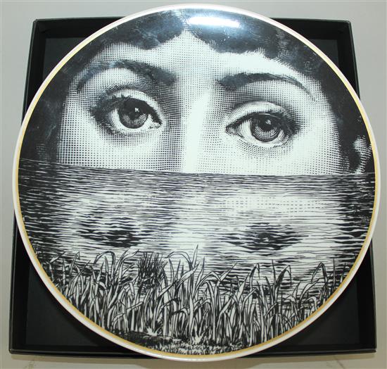 A collection of Fornasetti Temi e Variazioni and musical trophy pattern items,